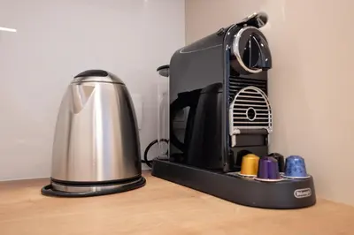 a coffee maker sitting on top of a table at Apartment Bovec by Liza in Bovec