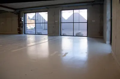an empty room with large windows in a building at Apartment Bovec by Liza in Bovec