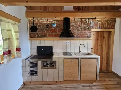 a small kitchen with a sink and a stove at Izba in Lendava