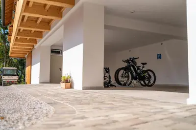 a bicycle is parked in a garage at Landhouse Bled in Selo pri Bledu