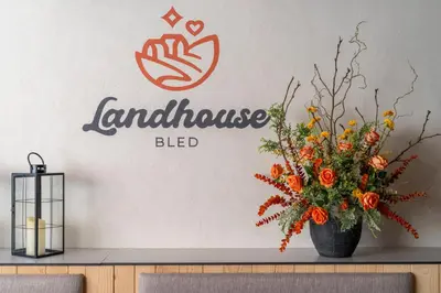 a vase with a bouquet of flowers on a table at Landhouse Bled in Selo pri Bledu