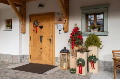 a front door of a house with christmas decorations at Landhouse Bled in Selo pri Bledu