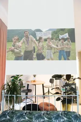 a group of people holding signs in a room at Central Garden Studio in Ljubljana