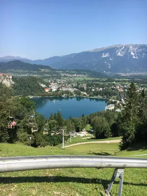a view of a lake with mountains in the background at Apartment Center in Bled