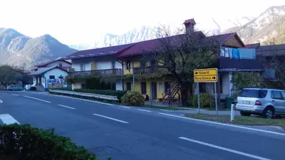 a street with houses on the side of the road at Apartments Ručna in Kobarid