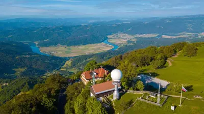 an aerial view of a house on a hill with a river at Tončkov dom na Lisci in Sevnica