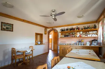 a kitchen with a table and a dining room at Rooms&Apartments Pazlar in Bled