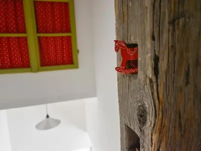a wooden pole with a picture of a horse on it at Rustic House 13 in Bohinj