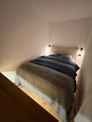 a bedroom with a bed in a room at Cosy getaway in raw nature in Šentjur