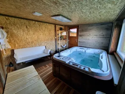 a jacuzzi tub in the middle of a room at Studio Apartma2 pri Adamu in Mislinja