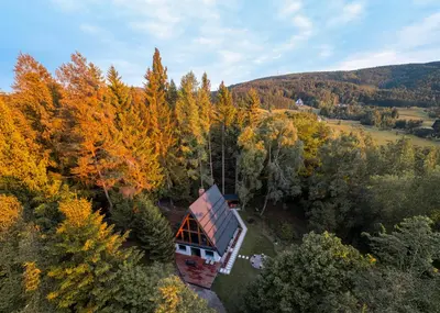 an aerial view of a house in the woods at Pohorska Gozdna Vila in Pohorje