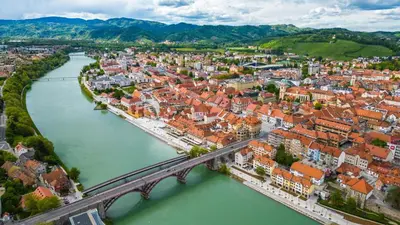 an aerial view of a city with a bridge over a river at Apartma Rače in Rače