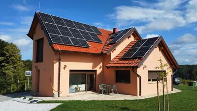 a house with solar panels on the roof at Ana&Borl House in Gradišča