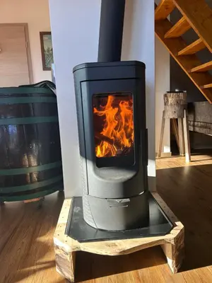 a wood stove is sitting in a room at Ana&Borl House in Gradišča