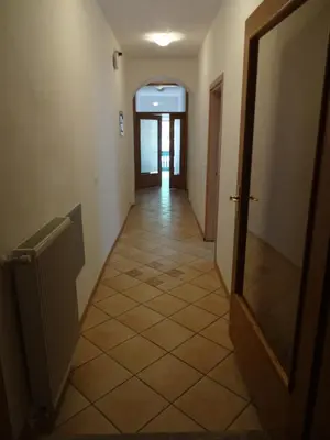 a hallway with a door and a tiled floor at Fedrig Private Rooms & Apartment in Kobarid
