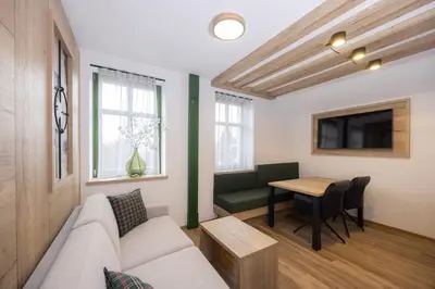a living room with a couch and a table at Vila Savica Bled in Bled
