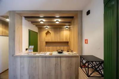 a room with a counter with a green door at Vila Savica Bled in Bled