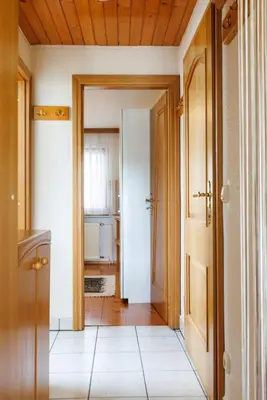 a hallway with a door open to a bathroom at Bled Veldes in Bled