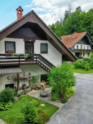 a house with a staircase on the side of it at Bled Veldes in Bled