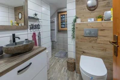 a bathroom with a sink and a toilet at Chalet Vrsnik Hideaway in Soča