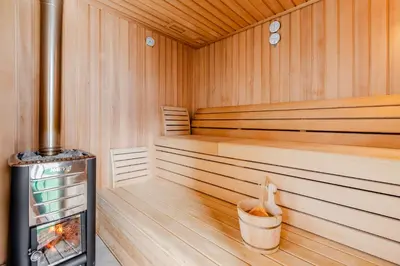 a sauna with a trash can in the middle at Pension Hosnar, apartma Gusto in Bovec