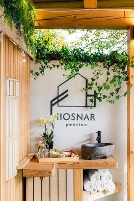a sign that says lesnar premier on a wall at Pension Hosnar, apartma Gusto in Bovec
