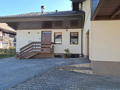 a house with a staircase in front of it at Prenočišče Breza in Radovljica