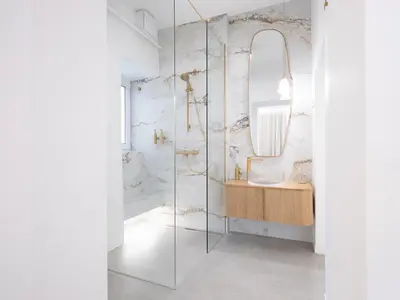 a bathroom with a glass shower and a sink at Trend Apartment in Ormoz