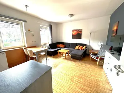 a living room with a couch and a table at Apartma Angela Bled in Bled