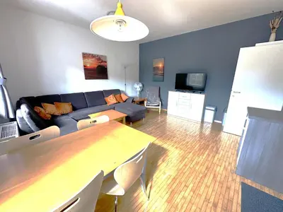 a living room with a couch and a table at Apartma Angela Bled in Bled