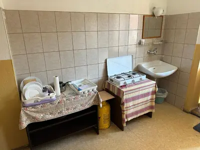 a small kitchen with a sink and a stove at Soba Pri Kosu in Slovenska Bistrica