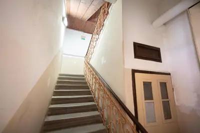 a stairway in a building with a door at Soba Pri Kosu in Slovenska Bistrica