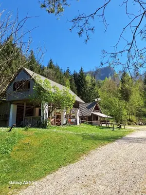 a log cabin with a gravel road in front of it at Princess Mojca Holiday House in Bled