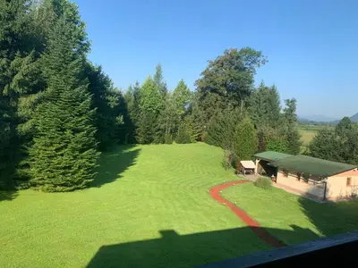 an aerial view of a large yard with a house at Apartments Villa Prod in Ljubljana