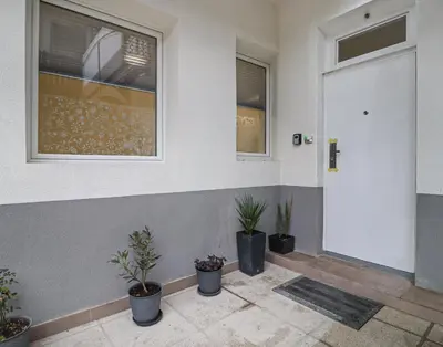 a front door of a house with potted plants at Secret Corner in Ljubljana