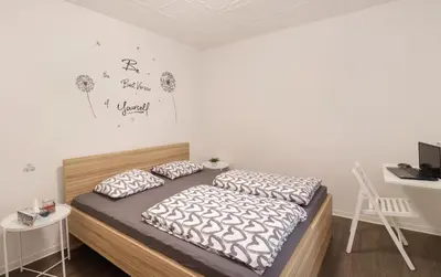 a bedroom with a bed with two pillows on it at Secret Corner in Ljubljana