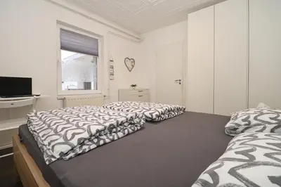 a bedroom with two beds and a television in it at Secret Corner in Ljubljana