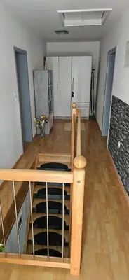 a room with a wine cellar with wooden racks at Hiša JAVORNIK BOHINJ in Bohinj