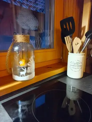 a mason jar with a picture of a deer on it next to a kitchen at Oaza miru in zdravja Goričko in Moravske Toplice