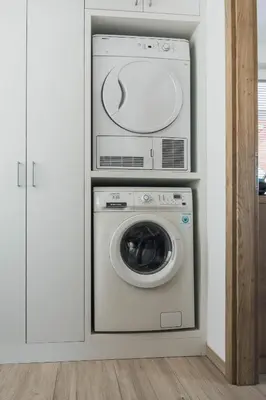 a laundry room with a washer and dryer at Harmony Resort in Cerklje na Gorenjskem