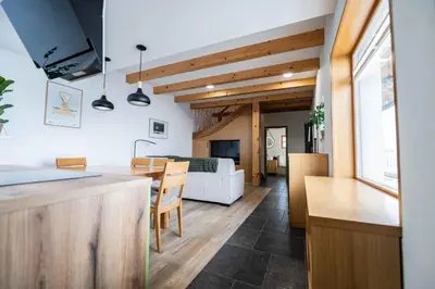 a kitchen and living room with a table and a couch at Holiday home in Trebnje - Kranjska (Krain) 53751 in Trebnje