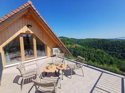 a patio with chairs and a table on a balcony at Holiday home in Trebnje - Kranjska (Krain) 53751 in Trebnje
