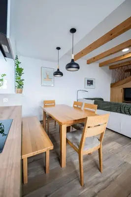 a dining room with a wooden table and chairs at Holiday home in Trebnje - Kranjska (Krain) 53751 in Trebnje
