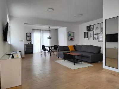 a living room with a couch and a table at Apartma WALK in in Brežice
