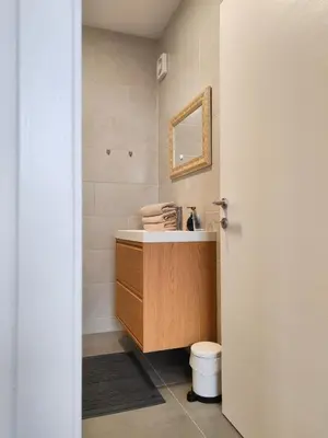 a bathroom with a sink and a toilet at Apartma WALK in in Brežice