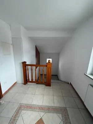 an empty hallway with a staircase in a room at Trnovo Lunca Apartment in Ljubljana