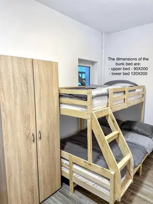 a bunk room with two bunk beds and a closet at Vesna Studios in Ljubljana