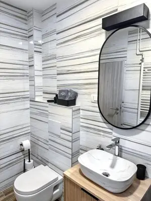 a bathroom with a white sink and a mirror at Vesna Studios in Ljubljana