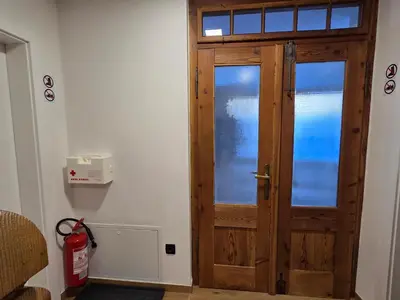 a wooden door in the corner of a room at Vila Natalia in Kranjska Gora
