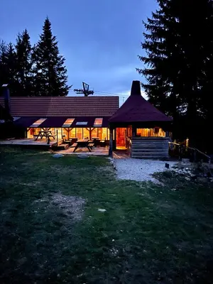 a large building with a gazebo in a yard at Chalet on Pohorje hill Maribor bike park next to the downhill track in Pohorje